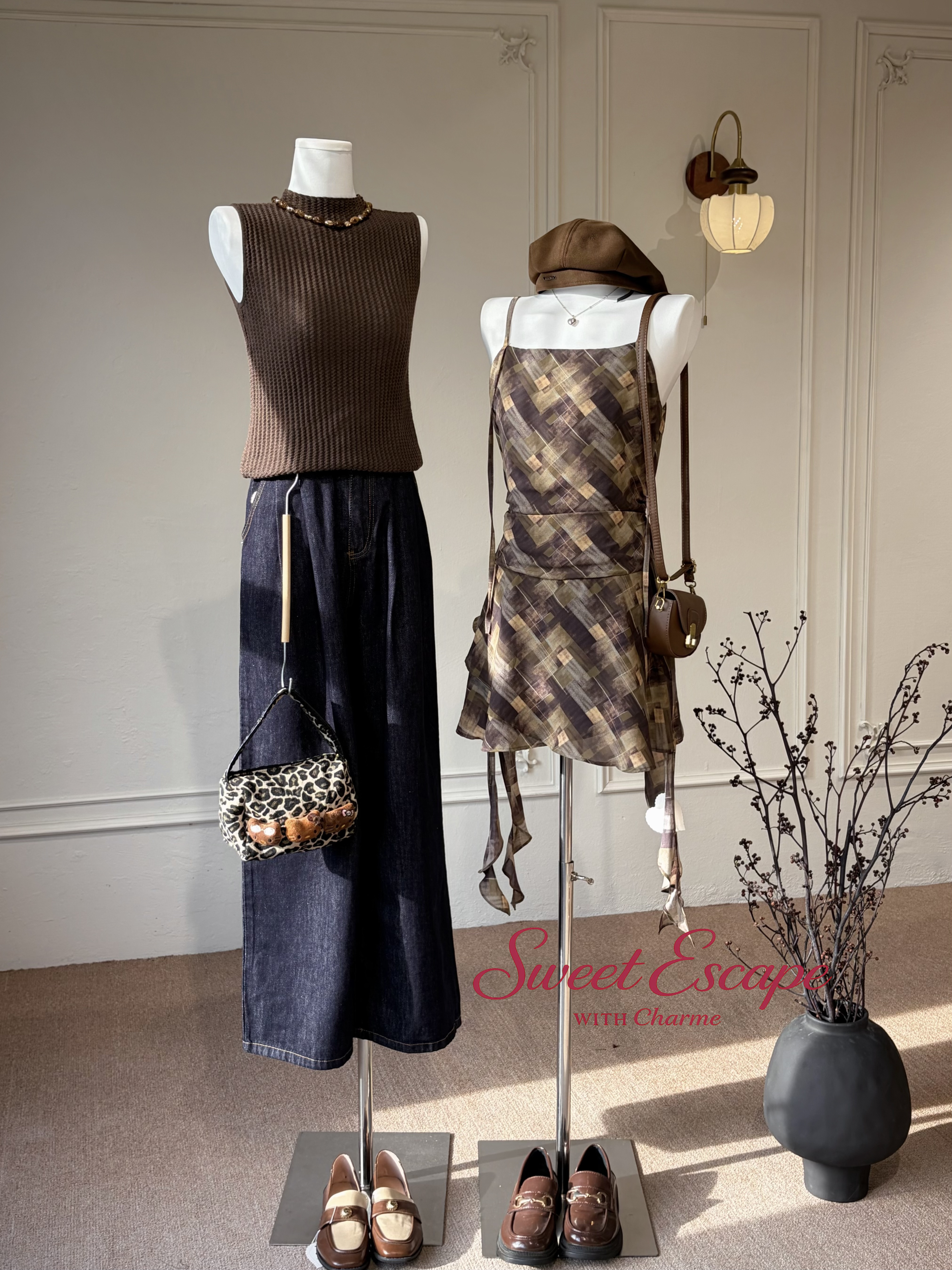 Mannequins with clothing and accessories in a room setting with 'Sweet Escape' branding.