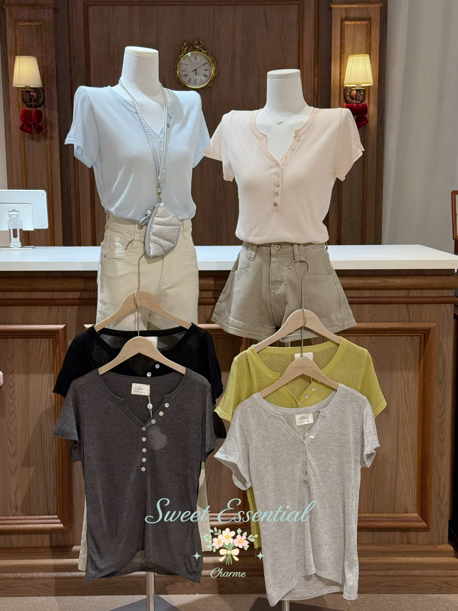 Mannequins wearing various shirts and shorts with 'Sweet Essential' branding in a store setting.