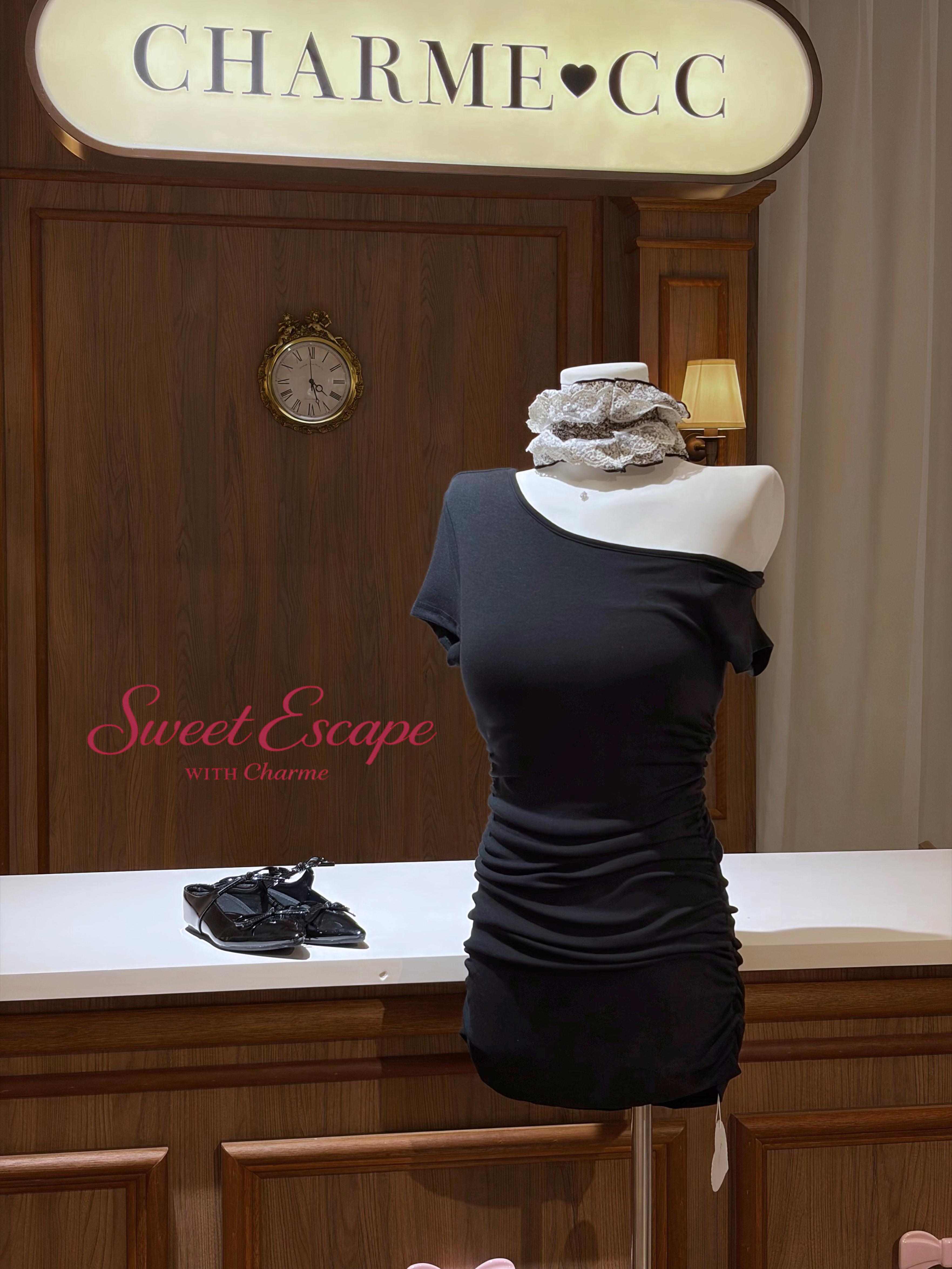 Black off shoulder ruched mini dress with fitted silhouette from Sweet Escape collection