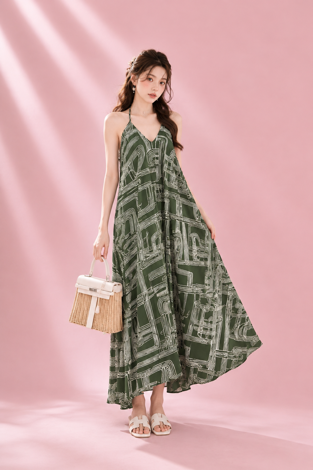 Woman wearing a green patterned dress against a pink background