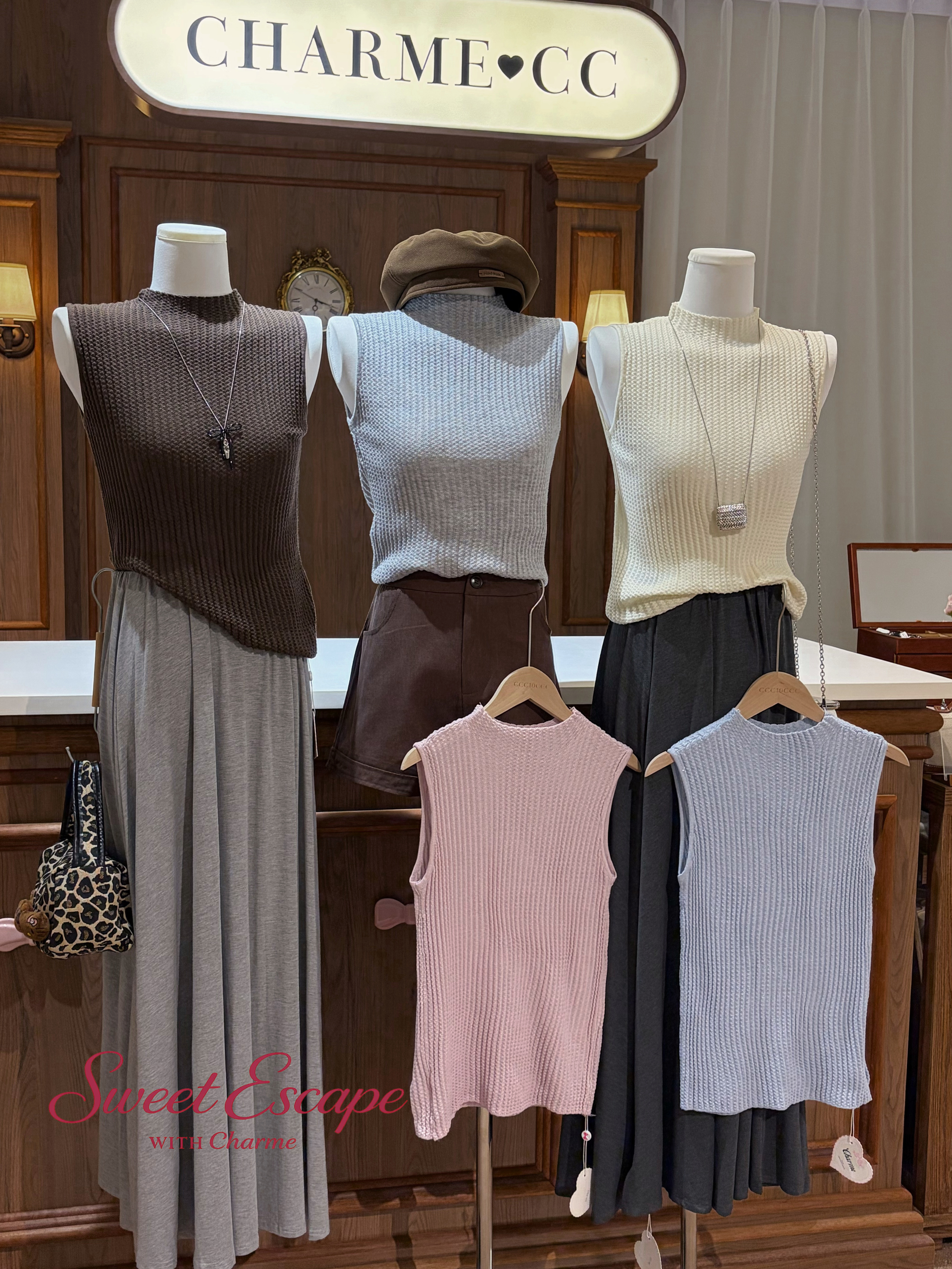 Textured knit sleeveless top in multiple colors with elegant high neckline