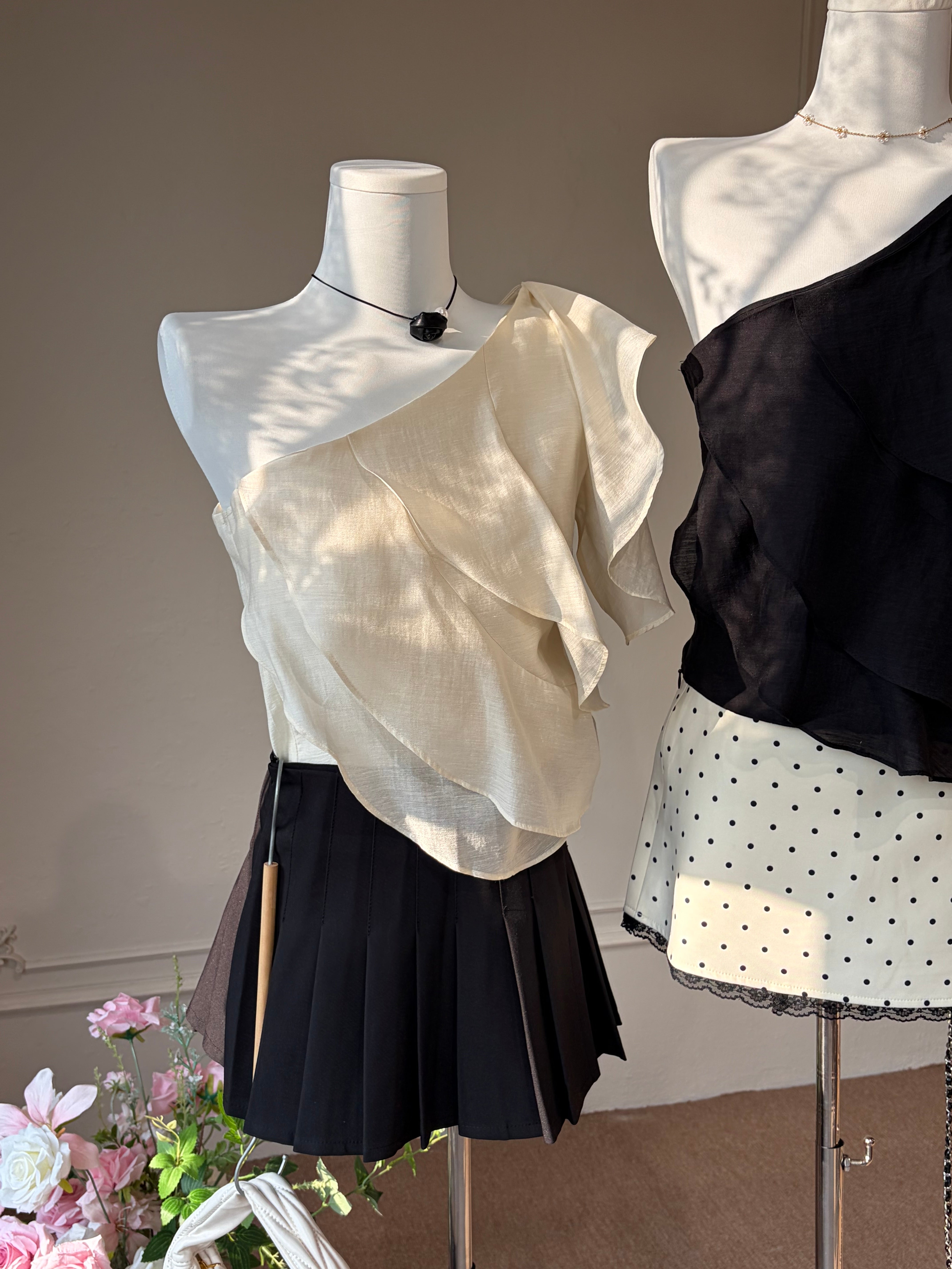Charme.cc Women's Clara Pleated Skirt - Black Pleated Mini Skirt Styled with White Lace Top and Silver Mary Jane Shoes