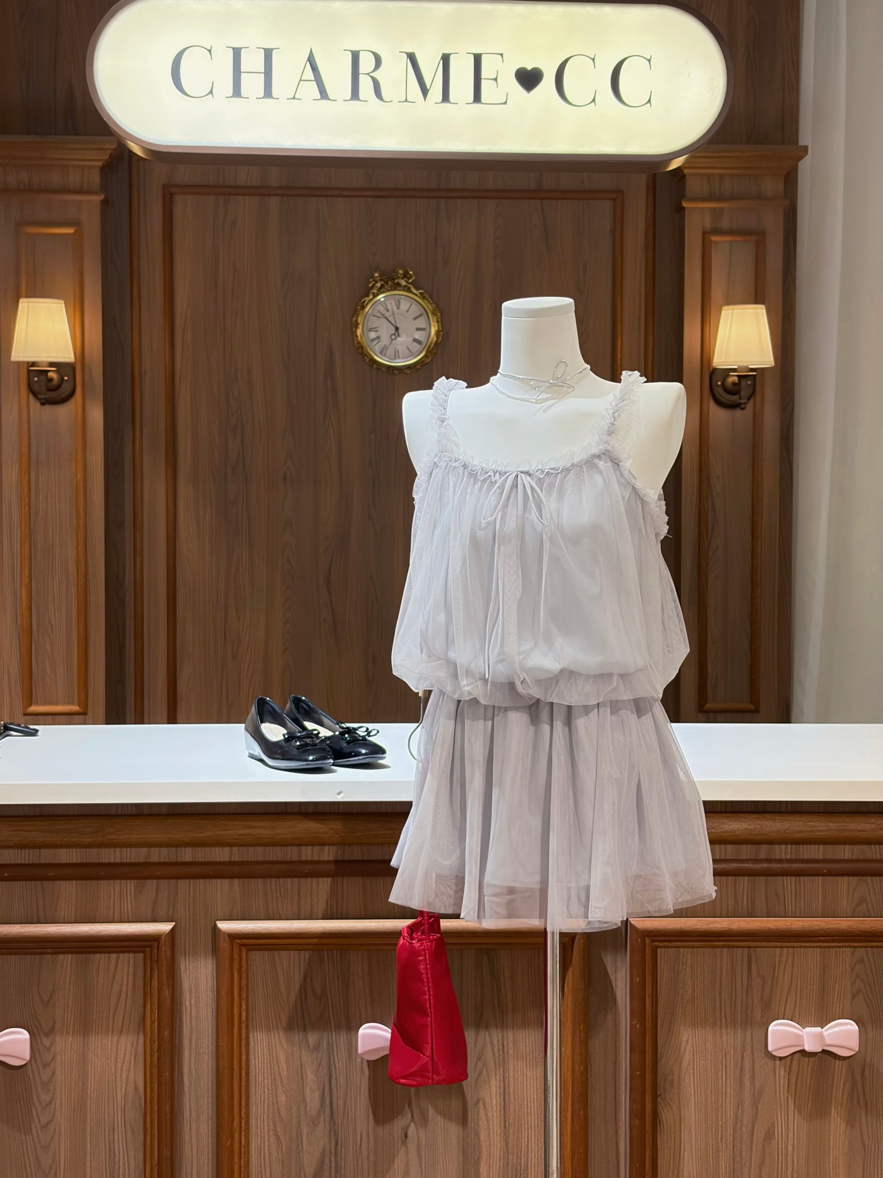 Feminine tulle dress with delicate tie front and flowy silhouette
