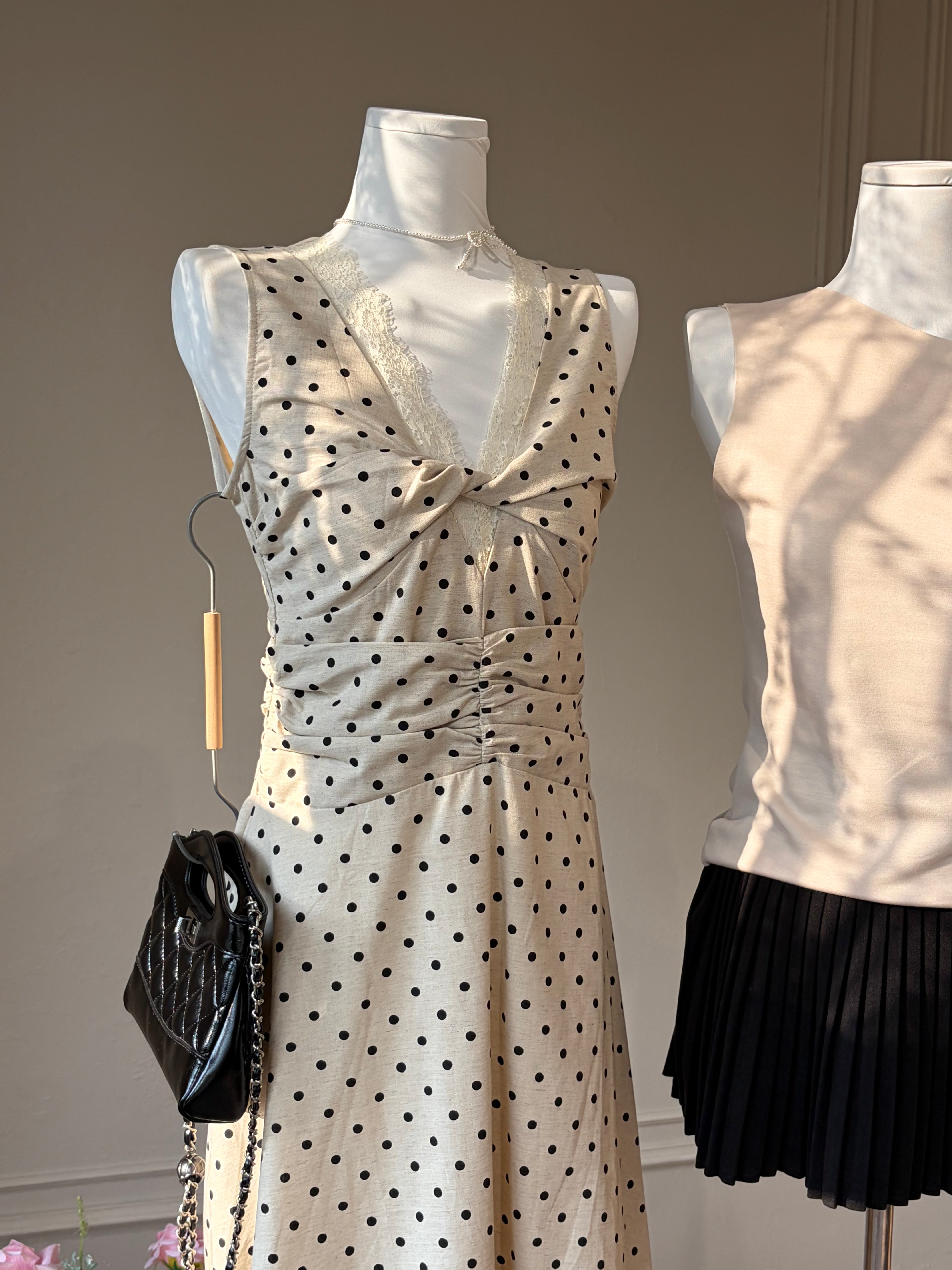 Charme.cc Amelie Polka Dress - Cream Polka Dot Midi Dress with Twist Front and Ruched Waist in details