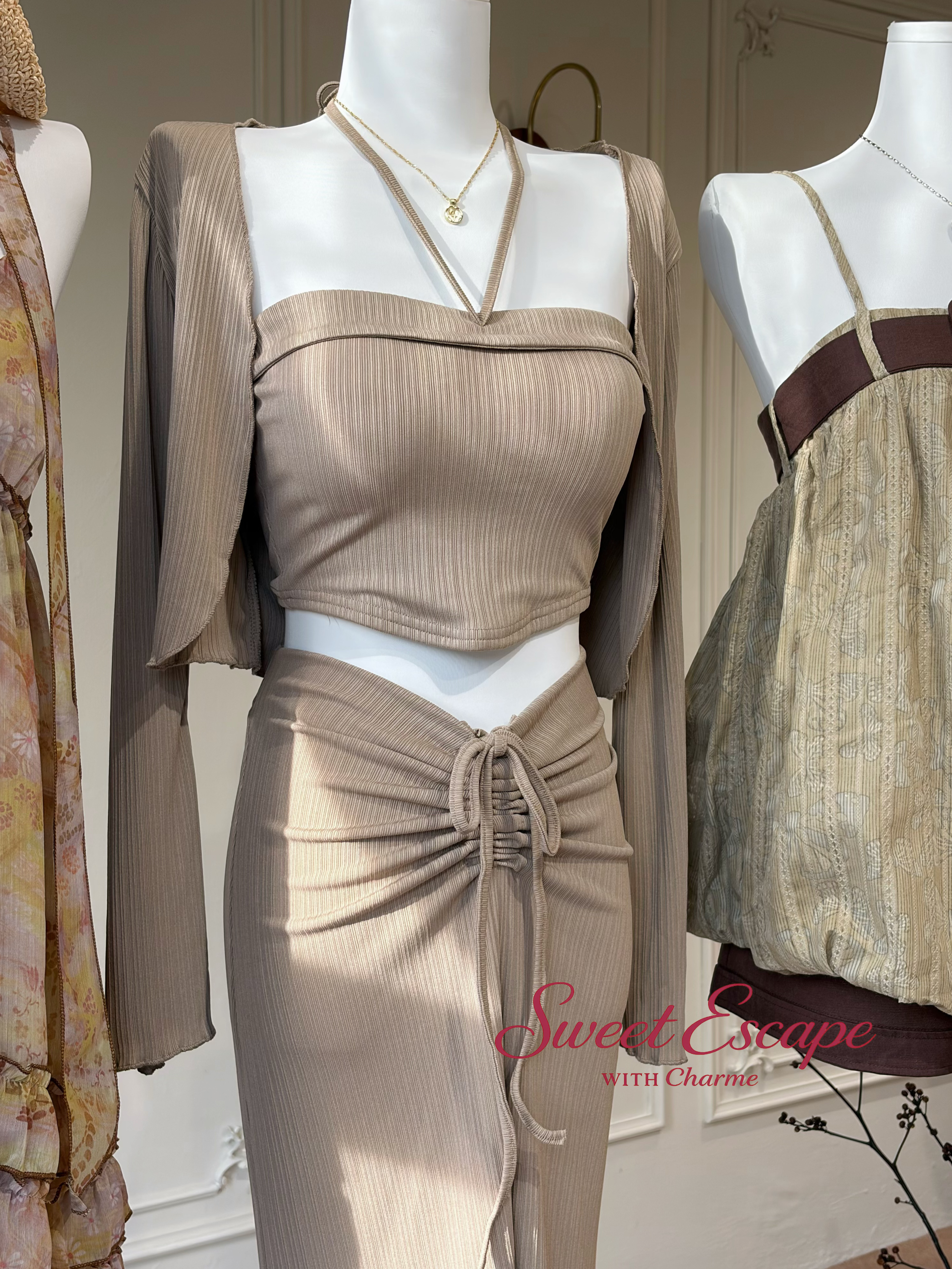 Close-up detail of ribbed maxi skirt set with ruched waist tie design